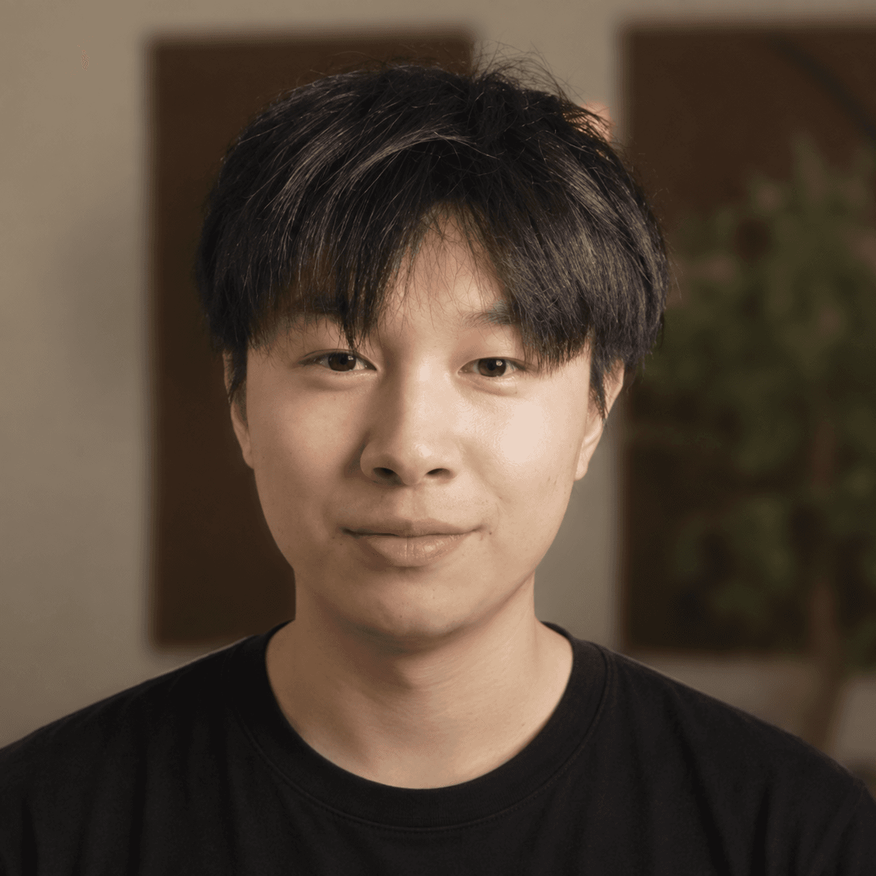 Alex Chen wearing a black shirt
